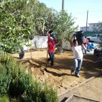Laying down the decomposed granite in the frontyard. It will allow two park 2 cars. And it's environmentally correct.