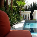 New oblong pool & Spa;
- medium grey stucco;
- blue glass tiles