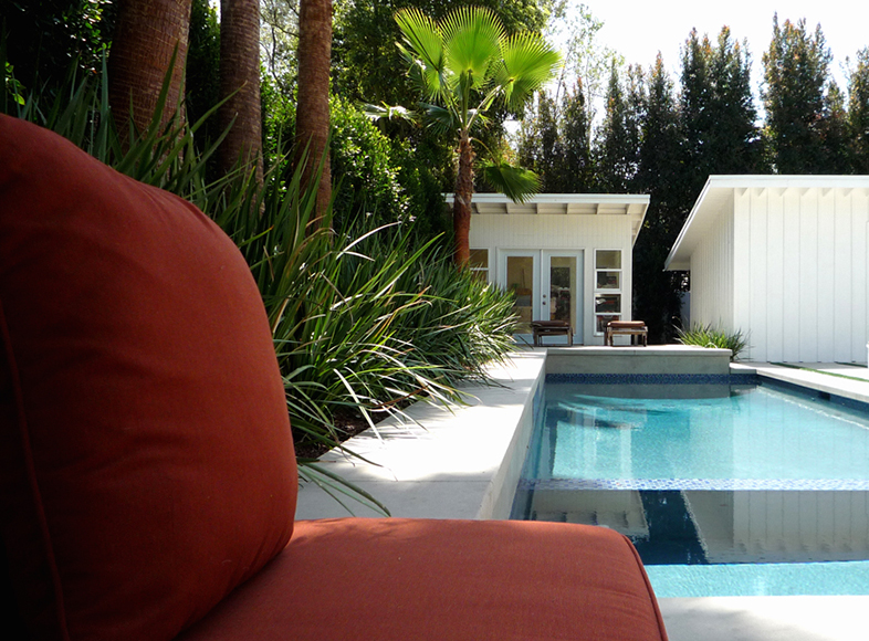 New oblong pool & Spa;
- medium grey stucco;
- blue glass tiles